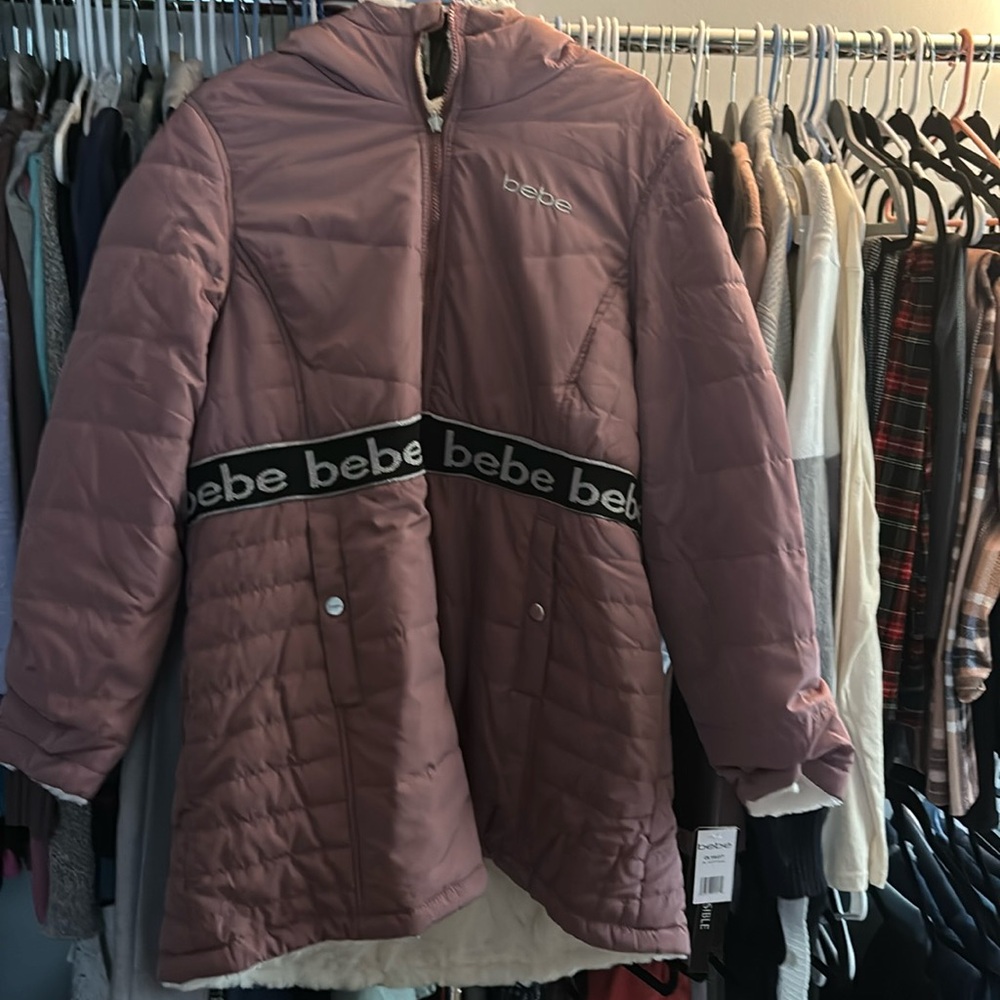 Bebe winter coat. Never worn. Still has the tags on it size large